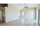 Bright, open living room with tile floors, vaulted ceilings, and multiple windows at 1630 W Pecan Rd, Phoenix, AZ 85041