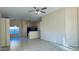 Open-concept living room with tile flooring and views into the kitchen area at 1630 W Pecan Rd, Phoenix, AZ 85041