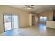 Open-concept living room featuring tile floors, sliding glass doors, and archways at 1630 W Pecan Rd, Phoenix, AZ 85041