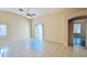 Spacious living room featuring tile floors, vaulted ceiling, and sliding glass door at 1630 W Pecan Rd, Phoenix, AZ 85041
