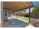 Backyard featuring covered patio, artificial turf, and lush landscape at 16417 S 43Rd Pl, Phoenix, AZ 85048