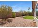 View of the well maintained rock landscaped backyard and block wall at 16417 S 43Rd Pl, Phoenix, AZ 85048