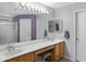 Bathroom with a double vanity, long mirror and walk in shower at 16417 S 43Rd Pl, Phoenix, AZ 85048