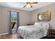 Cozy bedroom features hardwood floors and a sunny window with cacti view at 16417 S 43Rd Pl, Phoenix, AZ 85048