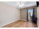 Bedroom with wood floors, a ceiling fan and a window with a view to the outdoors at 16417 S 43Rd Pl, Phoenix, AZ 85048