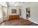 Dining room with hardwood floors, neutral paint, a sideboard, and view into the kitchen at 16417 S 43Rd Pl, Phoenix, AZ 85048