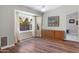 Dining room with hardwood floors, neutral paint, a ceiling fan, a bay window and sideboard at 16417 S 43Rd Pl, Phoenix, AZ 85048