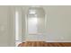 View of the entryway with tile floors, hardwood floors, and archways leading to other rooms in the house at 16417 S 43Rd Pl, Phoenix, AZ 85048