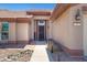Close up of the front entrance, featuring a welcome sign, desert landscaping, and the house number displayed at 16417 S 43Rd Pl, Phoenix, AZ 85048