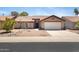 Single story home featuring a terracotta roof, desert landscaping, neutral paint, and two car garage at 16417 S 43Rd Pl, Phoenix, AZ 85048