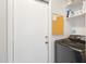 Laundry area featuring a black washing machine and plenty of shelving at 16417 S 43Rd Pl, Phoenix, AZ 85048