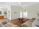 Open living area with hardwood floors, neutral paint, a ceiling fan, and archways leading to other rooms at 16417 S 43Rd Pl, Phoenix, AZ 85048
