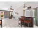 Cozy living area with a recliner, tile flooring, and a rustic bar setup with bar stools at 16417 S 43Rd Pl, Phoenix, AZ 85048