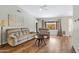 Bright living room featuring a ceiling fan, hardwood floors, neutral paint, and view to the backyard at 16417 S 43Rd Pl, Phoenix, AZ 85048