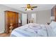 Spacious main bedroom featuring hardwood floors, ceiling fan and ensuite access at 16417 S 43Rd Pl, Phoenix, AZ 85048