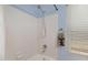 Close-up of a white tiled shower with light blue walls at 16417 S 43Rd Pl, Phoenix, AZ 85048