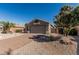 Charming single-story home featuring a brick driveway and low-maintenance desert landscaping at 18297 W Spencer Dr, Surprise, AZ 85374