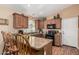 Well-lit kitchen with updated appliances, breakfast bar, and tiled countertops at 18297 W Spencer Dr, Surprise, AZ 85374