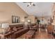 Comfortable living room with hardwood floors and an open floorplan leading to the dining room at 18297 W Spencer Dr, Surprise, AZ 85374