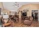 Spacious living room featuring a vaulted ceiling, hardwood floors and an open floorplan at 18297 W Spencer Dr, Surprise, AZ 85374
