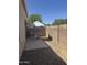 Backyard patio featuring seating beneath an umbrella at 18650 N 91St Ave # 1501, Peoria, AZ 85382
