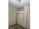 Empty bedroom showing sliding closet doors and neutral carpet at 18650 N 91St Ave # 1501, Peoria, AZ 85382