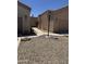 Exterior view of two beige homes with desert landscaping and a shared walkway at 18650 N 91St Ave # 1501, Peoria, AZ 85382