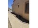 Side view of home featuring low-water landscaping and desert plants at 18650 N 91St Ave # 1501, Peoria, AZ 85382