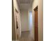 Hallway with a wooden cabinet and doors at 18650 N 91St Ave # 1501, Peoria, AZ 85382