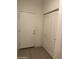 Hallway featuring neutral walls and doors including a closet at 18650 N 91St Ave # 1501, Peoria, AZ 85382