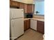 View of the kitchen featuring classic cabinets and white appliances at 18650 N 91St Ave # 1501, Peoria, AZ 85382