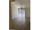 Bright and airy living room featuring a ceiling fan and patio doors at 18650 N 91St Ave # 1501, Peoria, AZ 85382