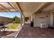 Large covered patio with brick flooring and a spacious area for outdoor activities at 18669 W Vista Norte St, Goodyear, AZ 85338