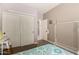 Cozy bedroom featuring wood floors, closet and colorful comforter at 18669 W Vista Norte St, Goodyear, AZ 85338