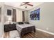 Bedroom with ceiling fan, dresser, carpet and wall art at 18669 W Vista Norte St, Goodyear, AZ 85338