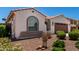 Charming single-story home features a well-maintained front yard with a two car garage and a tiled roof at 18669 W Vista Norte St, Goodyear, AZ 85338