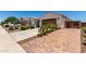 Charming single-story home features a well-maintained front yard with a two car garage and a tiled roof at 18669 W Vista Norte St, Goodyear, AZ 85338