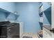 Laundry room featuring washer, dryer and ample storage at 18669 W Vista Norte St, Goodyear, AZ 85338
