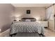 Comfortable bedroom with plush bedding, decorative art, and natural light at 18669 W Vista Norte St, Goodyear, AZ 85338