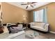 Office space with ample lighting, ceiling fan and white sofa at 18669 W Vista Norte St, Goodyear, AZ 85338