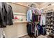Organized walk-in closet with shelving, hanging racks, and ample storage space at 18669 W Vista Norte St, Goodyear, AZ 85338