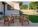 Cozy outdoor patio with comfortable seating, a grill, and a wooden table, creating a perfect spot for relaxation and dining at 217 E Bruce Ave, Gilbert, AZ 85234