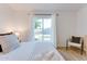 Light and airy bedroom with bright walls, patio access, and pool view at 217 E Bruce Ave, Gilbert, AZ 85234