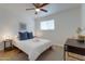 Comfortable bedroom featuring a ceiling fan, plush bedding, and side tables with modern lamps at 217 E Bruce Ave, Gilbert, AZ 85234