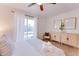 Relaxing bedroom with neutral tones, patio access, and a view of the pool area at 217 E Bruce Ave, Gilbert, AZ 85234