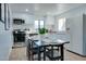 Clean kitchen with stainless appliances, eat-in area, and white cabinets at 217 E Bruce Ave, Gilbert, AZ 85234