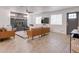 Living room with tile flooring and a stunning stone fireplace, bathed in natural light at 217 E Bruce Ave, Gilbert, AZ 85234