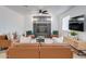View of living room showcasing modern design, stone fireplace, and neutral color palette at 217 E Bruce Ave, Gilbert, AZ 85234
