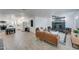Open-concept living room and kitchen featuring wood-look floors and a stone fireplace at 217 E Bruce Ave, Gilbert, AZ 85234