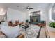 Living room features a cozy fireplace, comfortable seating, and a stylish rug at 217 E Bruce Ave, Gilbert, AZ 85234